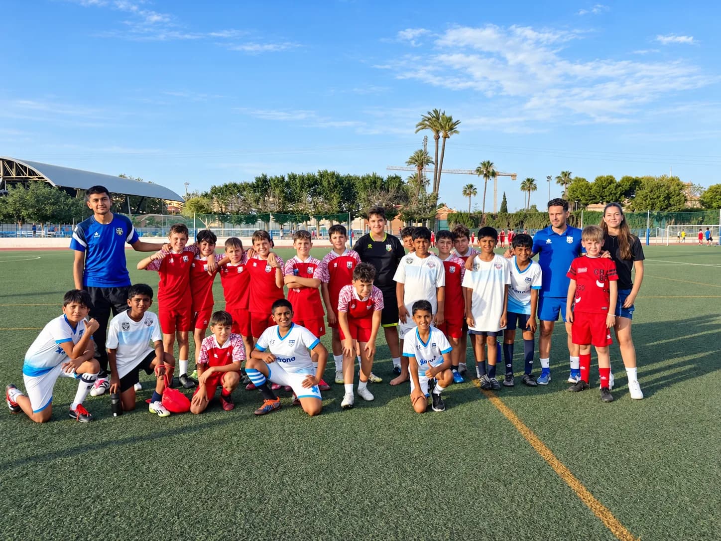 Young Xdrona players and a coach at a Spanish academy.